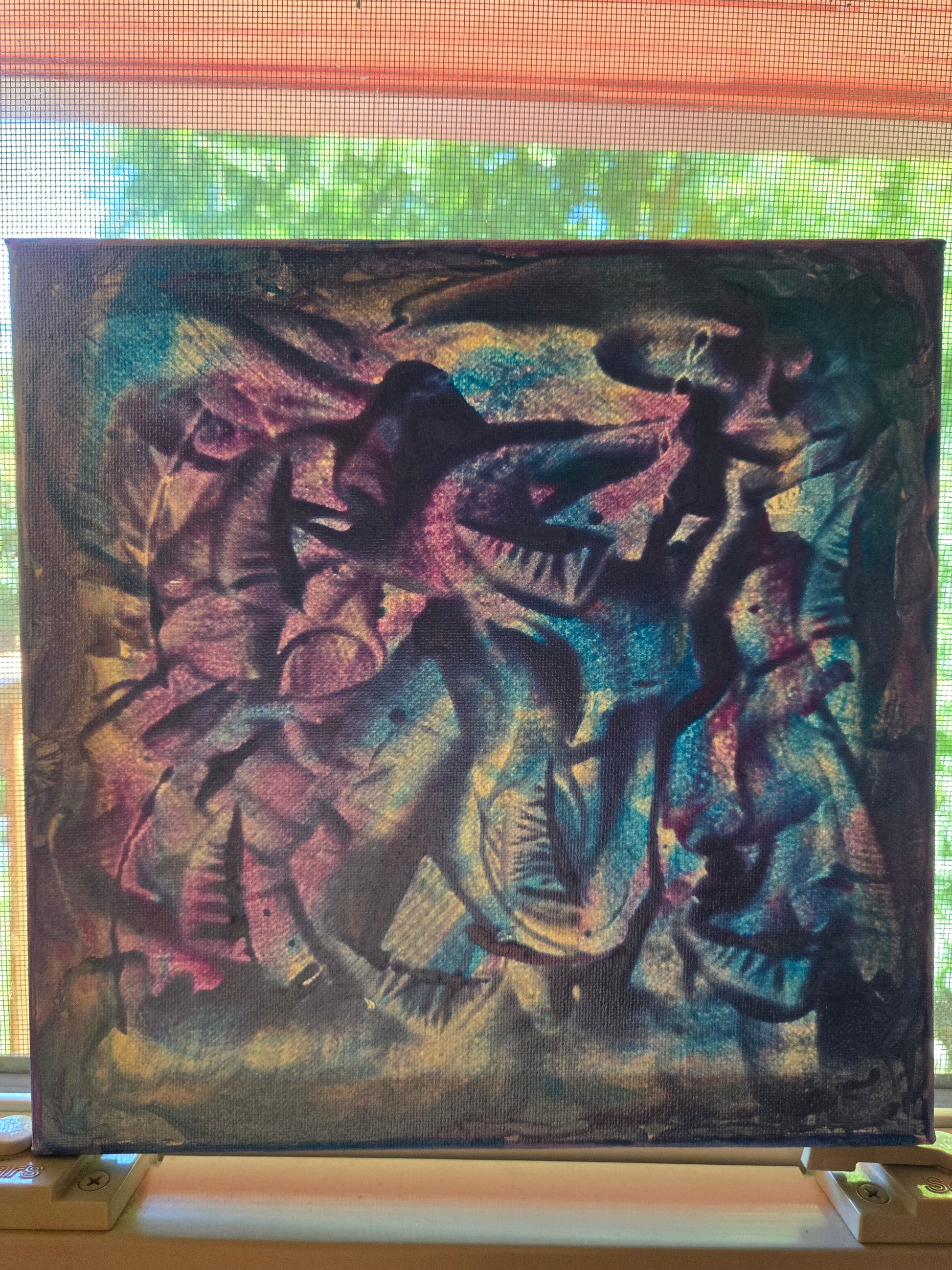 Abstract painting on a canvas with colorful swirling patterns.